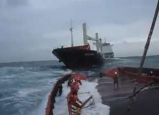 
Tug Boat Crew Working in Rough Sea

