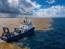 A research vessel (oceanographic research ship) navigating the Atlantic Ocean near the mouth of the Amazon River, with m…